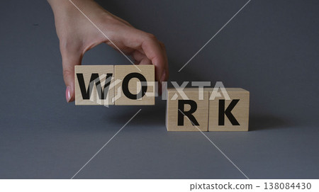 Work symbol. Concept word Work on wooden cubes. Businessman hand. Beautiful grey background. Business and Work concept. Copy space. Work symbol. Concept word Work on wooden cubes. Businessman hand. Beautiful grey background. Business and Work concept. Copy space. 138084430