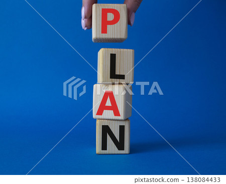 Plan symbol. Concept word Plan on wooden cubes. Businessman hand. Beautiful blue background. Business and Plan concept. Copy space. 138084433