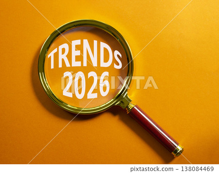 Trends 2026 symbol. Magnifying Glass with words Trends 2026. Beautiful orange background. Business and Trends 2026 concept. Copy space. Trends 2026 symbol. Magnifying Glass with words Trends 2026. Beautiful orange background. Business and Trends 2026 concept. Copy space. 138084469