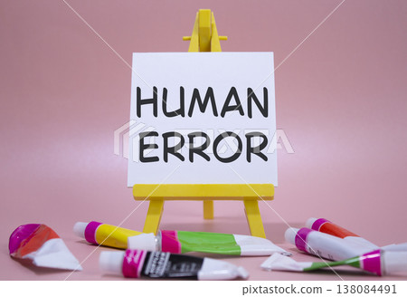 Human Error symbol. Concept word Human Error on wooden blocks. Beautiful white background with paints and easel. Medicine and Human Error concept. Copy space Human Error symbol. Concept word Human Error on wooden blocks. Beautiful white background with paints and easel. Medicine and Human Error concept. Copy space 138084491