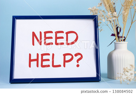 Need Help symbol. Concept words Need Help on beautiful wooden picture frame. Beautiful light blue background with flower vase. Business and Need Help concept. Copy space. 138084502