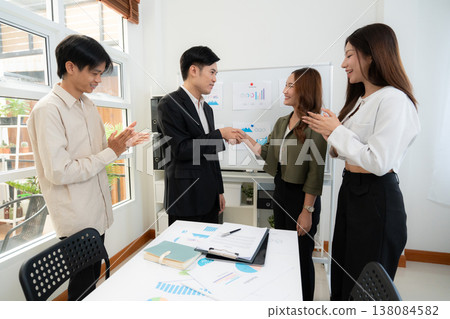 Asian business team handshake for success agreement after marketing presentation. Asian business team handshake for success agreement after marketing presentation. 138084582