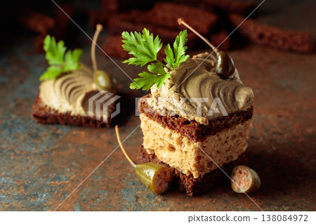 Bread with pate, capers, and fresh parsley. Bread with pate, capers, and fresh parsley. 138084972