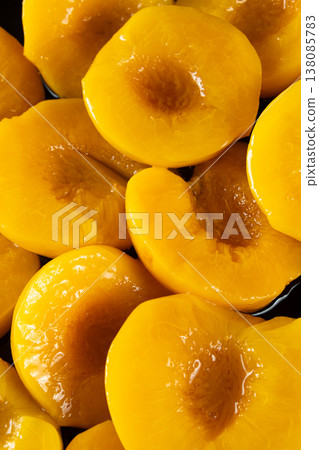 Group of preserved yellow peaches as a delicious food background. Group of preserved yellow peaches as a delicious food background. 138085783