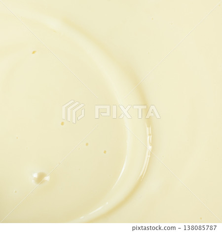 Smooth condensed milk texture with tiny bubbles macro. 138085787