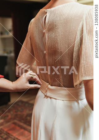 Back buttons and sash tied on delicate sheer bridal blouse Back buttons and sash tied on delicate sheer bridal blouse 138085938