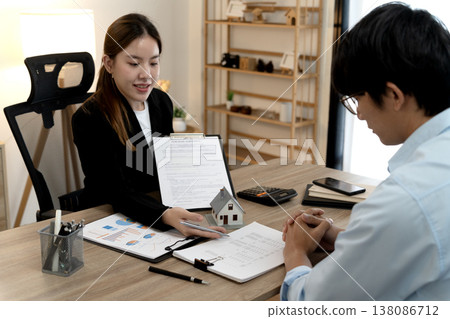 Young business woman is talking about presenting real estate Young business woman is talking about presenting real estate 138086712