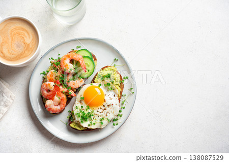 Avocado Shrimp and Fried Egg Sandwiches and coffee for low carb breakfast 138087529