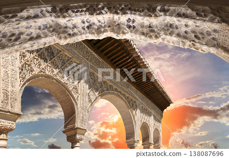 Arches in Islamic (Moorish) style (against the sunset) in Alhambra, Granada, Spain Arches in Islamic (Moorish) style (against the sunset) in Alhambra, Granada, Spain 138087696