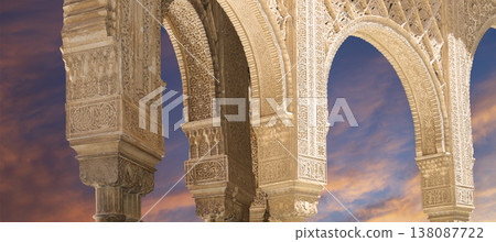 Arches in Islamic (Moorish) style (against the sunset) in Alhambra, Granada, Spain 138087722