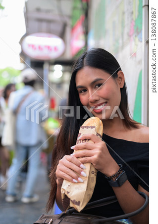 Thai Woman Eating Banh Mi Sandwich Hanoi Vietnam Thai Woman Eating Banh Mi Sandwich Hanoi Vietnam 138087867