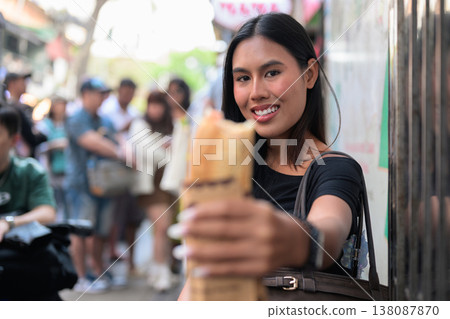 Thai Woman Eating Banh Mi Sandwich Hanoi Vietnam Thai Woman Eating Banh Mi Sandwich Hanoi Vietnam 138087870