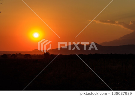Beautiful african sunset over savannah in Tanzania Beautiful african sunset over savannah in Tanzania 138087989