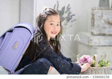 A Japanese girl holding a basket looks at me. A Japanese girl holding a basket looks at me. 138088130