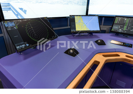 A modern ship simulator bridge, blue navigation console A modern ship simulator bridge, blue navigation console 138088394