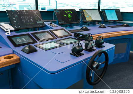 Virtual ship bridge featuring blue control consoles Virtual ship bridge featuring blue control consoles 138088395