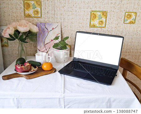 Content creation setup with laptop, flowers, and fruits, lifestyle photography scene Content creation setup with laptop, flowers, and fruits, lifestyle photography scene 138088747