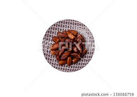 Dried dates on a ceramic plate for Ramadan or Iftar. Dates fruit as a background 138088759