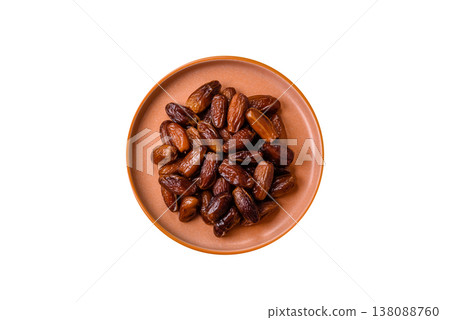 Dried dates on a ceramic plate for Ramadan or Iftar. Dates fruit as a background 138088760