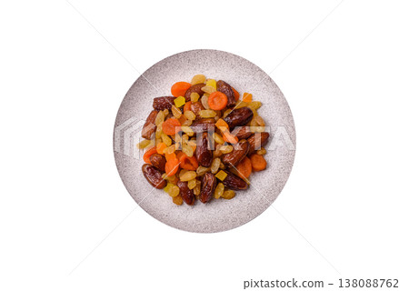 Dried apricots, raisins, and candied fruits as ingredients for baked goods and sweets. Dried fruits 138088762