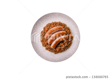 Lentil, carrot, and tomato stew with sausages, a European dish. Lentils with sausages Lentil, carrot, and tomato stew with sausages, a European dish. Lentils with sausages 138088765