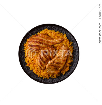 Kabsa or haneeth, an Arabic dish with rice and chicken, salt, and spices. Kabsa or haneeth Kabsa or haneeth, an Arabic dish with rice and chicken, salt, and spices. Kabsa or haneeth 138088774