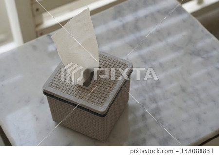 top view color gray and black plastic tissue box sits on a marble table, Outside background, object, clean, decor, comfortable, copy space top view color gray and black plastic tissue box sits on a marble table, Outside background, object, clean, decor, comfortable, copy space 138088831