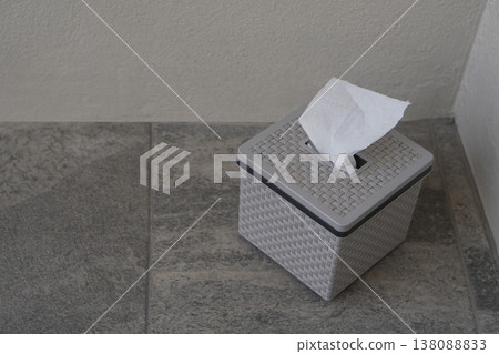 top view gray and black plastic tissue boxes sit on the grey tiled floor and white wall background, clean, object, decor, ancient, fashion, copy space 138088833
