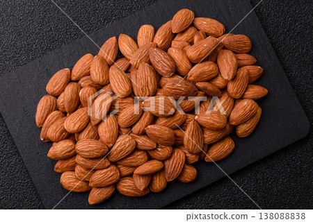 Raw and peeled almonds as a healthy food ingredient. Almonds as a food background Raw and peeled almonds as a healthy food ingredient. Almonds as a food background 138088838