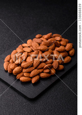 Raw and peeled almonds as a healthy food ingredient. Almonds as a food background Raw and peeled almonds as a healthy food ingredient. Almonds as a food background 138088839