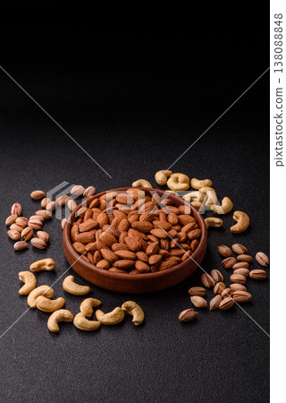 Raw and peeled almonds as a healthy food ingredient. Almonds as a food background Raw and peeled almonds as a healthy food ingredient. Almonds as a food background 138088848