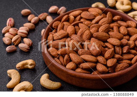 Raw and peeled almonds as a healthy food ingredient. Almonds as a food background Raw and peeled almonds as a healthy food ingredient. Almonds as a food background 138088849
