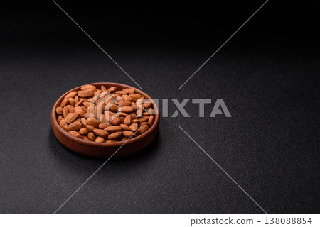 Raw and peeled almonds as a healthy food ingredient. Almonds as a food background Raw and peeled almonds as a healthy food ingredient. Almonds as a food background 138088854