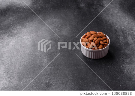 Raw and peeled almonds as a healthy food ingredient. Almonds as a food background Raw and peeled almonds as a healthy food ingredient. Almonds as a food background 138088858