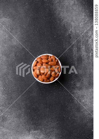 Raw and peeled almonds as a healthy food ingredient. Almonds as a food background Raw and peeled almonds as a healthy food ingredient. Almonds as a food background 138088859