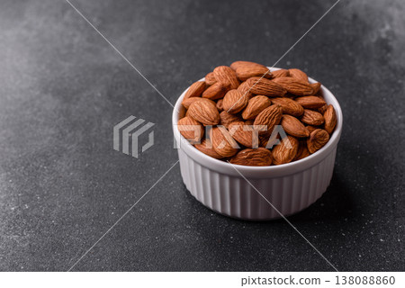 Raw and peeled almonds as a healthy food ingredient. Almonds as a food background Raw and peeled almonds as a healthy food ingredient. Almonds as a food background 138088860