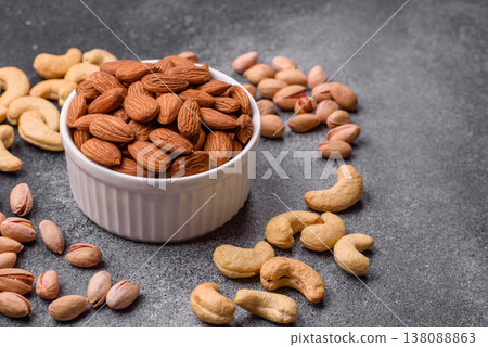 Raw and peeled almonds as a healthy food ingredient. Almonds as a food background Raw and peeled almonds as a healthy food ingredient. Almonds as a food background 138088863