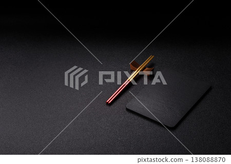 An empty slate cutting board with cutlery on a kitchen counter. Slate cutting board An empty slate cutting board with cutlery on a kitchen counter. Slate cutting board 138088870