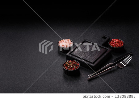 An empty wooden cutting board with cutlery on a kitchen counter. A wooden cutting board An empty wooden cutting board with cutlery on a kitchen counter. A wooden cutting board 138088895