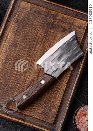 An empty wooden cutting board with cutlery on a kitchen counter. A wooden cutting board An empty wooden cutting board with cutlery on a kitchen counter. A wooden cutting board 138088910