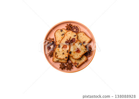 Fruit cake, a dessert with cherries, plums, and raisins for a festive Christmas table. Fruit cake Fruit cake, a dessert with cherries, plums, and raisins for a festive Christmas table. Fruit cake 138088928