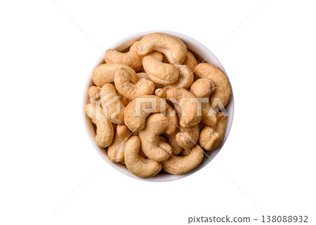 Roasted or raw cashew make a savory snack for a healthy, filling meal. Cashew nuts Roasted or raw cashew make a savory snack for a healthy, filling meal. Cashew nuts 138088932