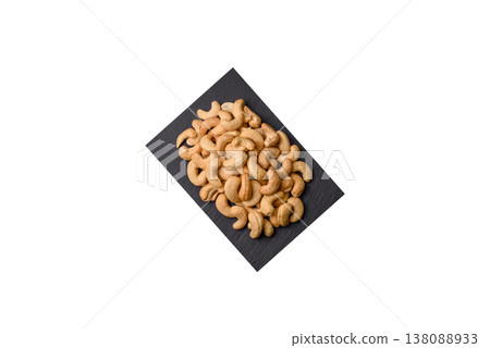 Roasted or raw cashew make a savory snack for a healthy, filling meal. Cashew nuts Roasted or raw cashew make a savory snack for a healthy, filling meal. Cashew nuts 138088933