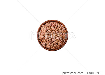 Salted pistachio nuts in shells as a healthy, high calorie food ingredient. Pistachio nuts 138088943