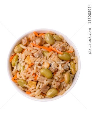 Asian food with rice, edamame, carrots, tofu, and spices. Rice with edamame and carrots Asian food with rice, edamame, carrots, tofu, and spices. Rice with edamame and carrots 138088954