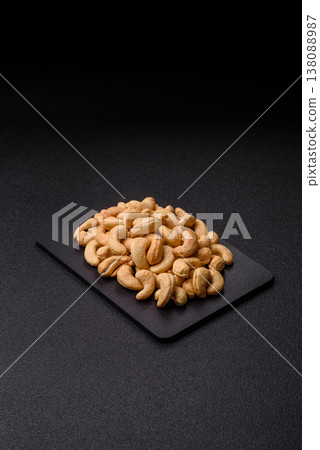 Roasted or raw cashew make a savory snack for a healthy, filling meal. Cashew nuts Roasted or raw cashew make a savory snack for a healthy, filling meal. Cashew nuts 138088987