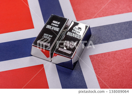 A silver bar against a backdrop of Norway flag, as a concept for the sales market. A silver bar 138089064