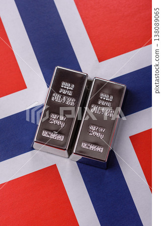 A silver bar against a backdrop of Norway flag, as a concept for the sales market. A silver bar A silver bar against a backdrop of Norway flag, as a concept for the sales market. A silver bar 138089065