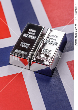 A silver bar against a backdrop of Norway flag, as a concept for the sales market. A silver bar 138089066
