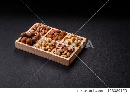 A mix of cashews, pistachios, almonds, macadamia and hazelnuts. Nuts as a food background A mix of cashews, pistachios, almonds, macadamia and hazelnuts. Nuts as a food background 138089153